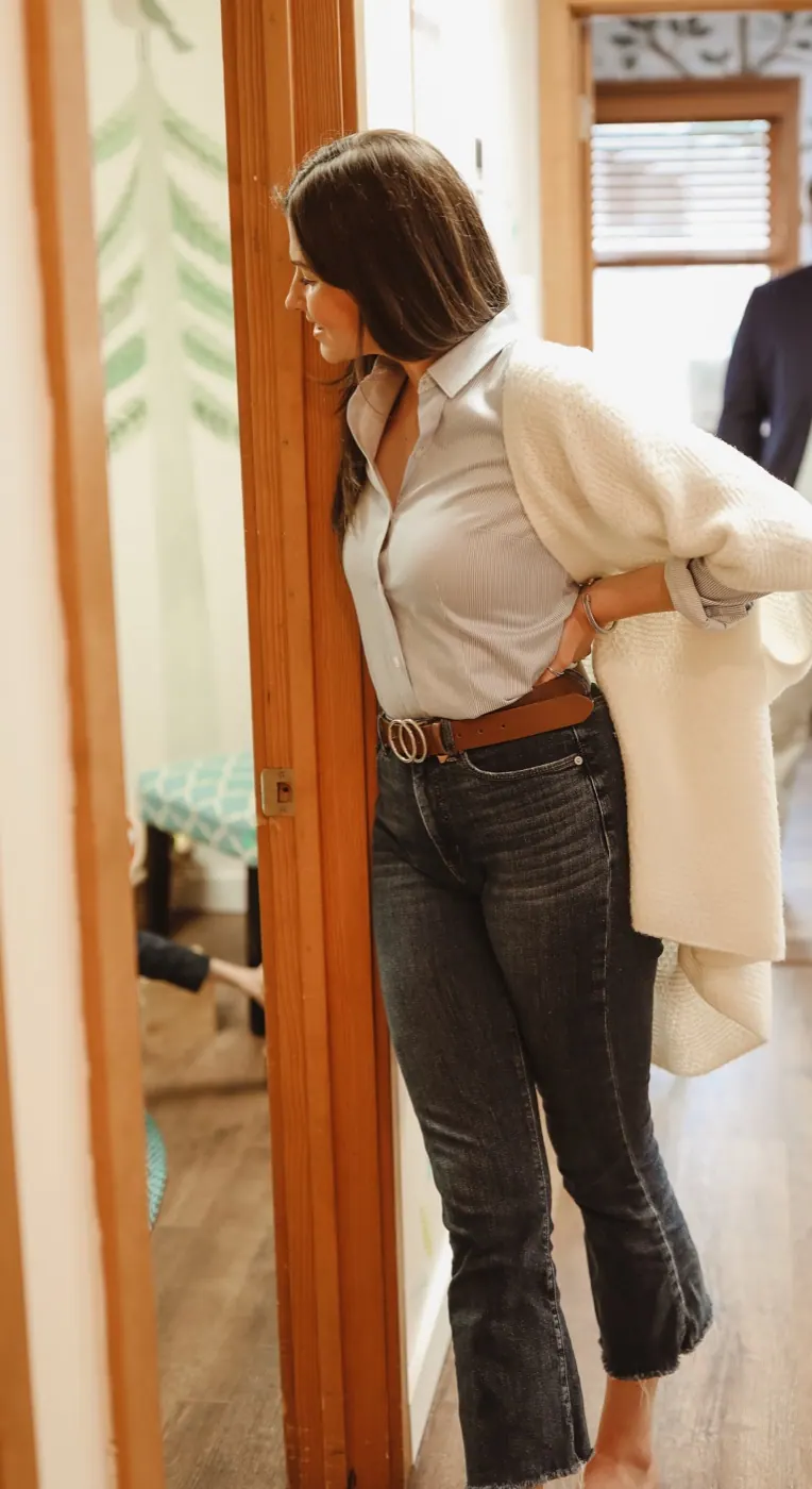 A Traina team member stepping through a doorway into the next room