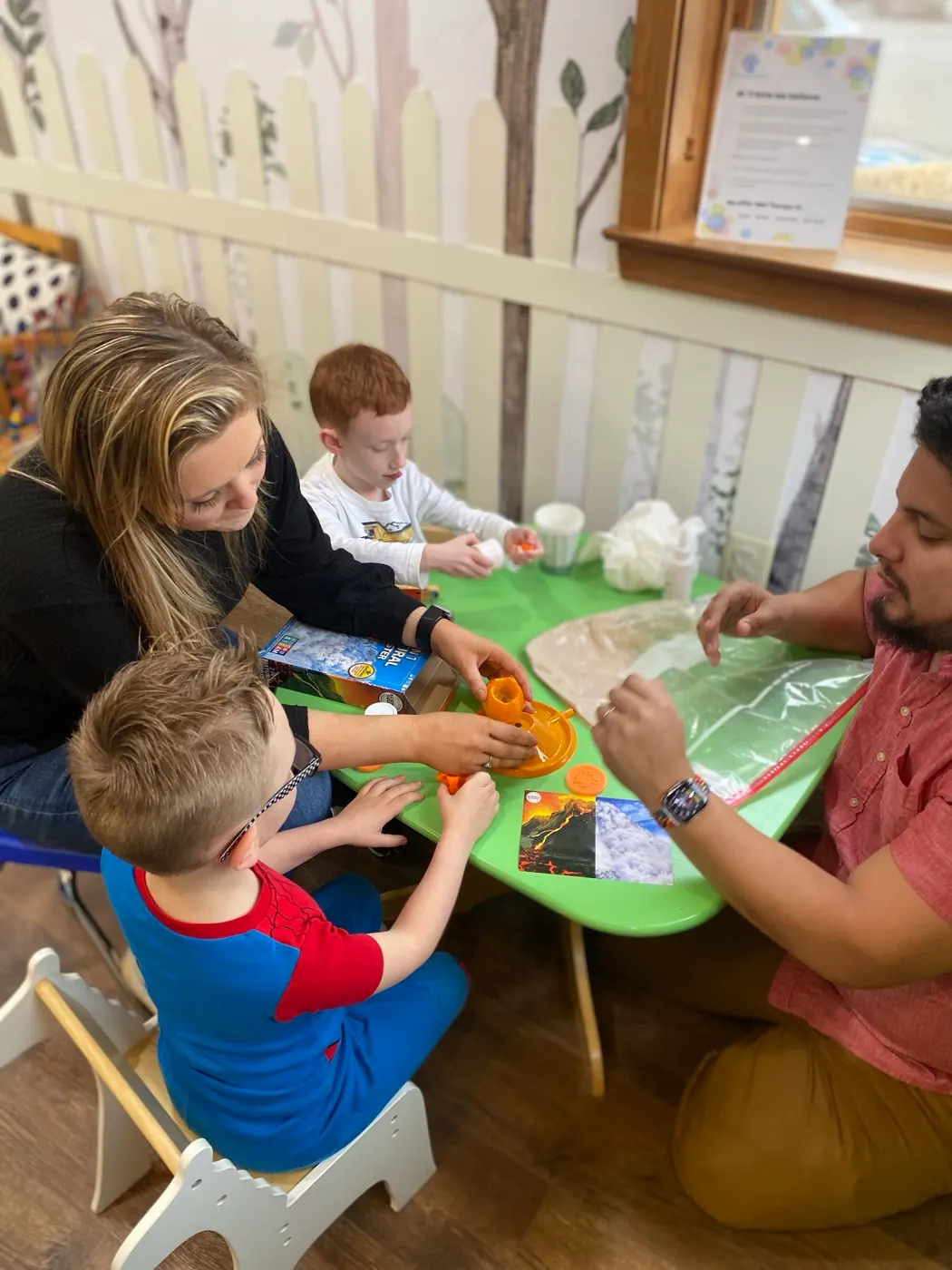 A Traina clinician guiding a structured table activity during a session